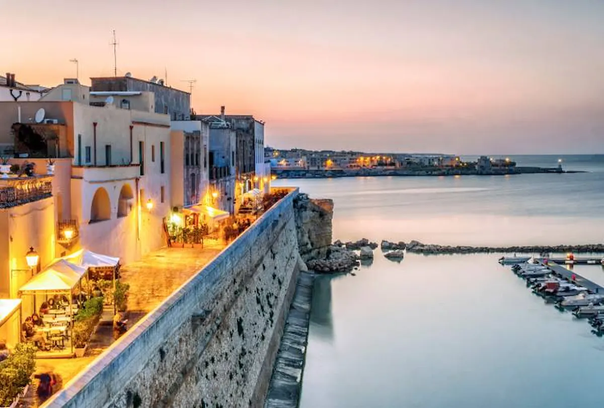 Panoramic view of Otranto historic centre and coastline at sunset, Puglia